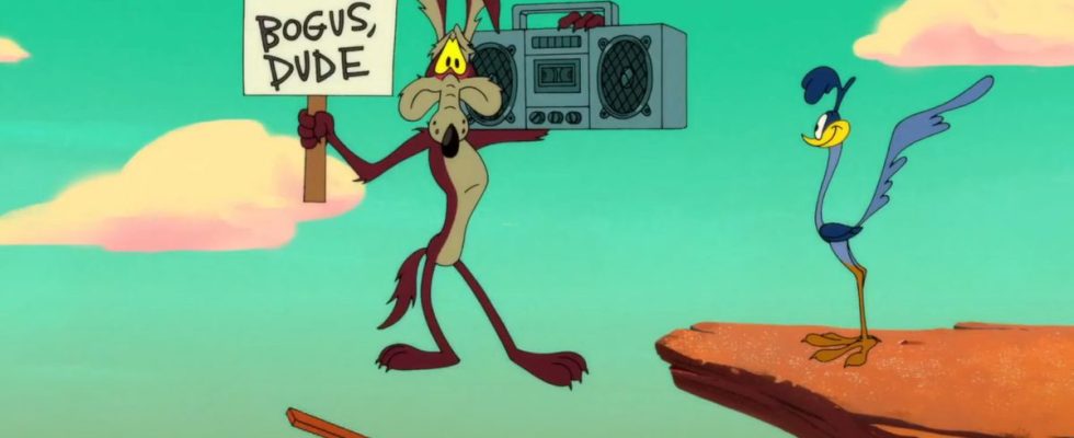 Wile E. Coyote about to plummet, while holding a sign and a boombox,