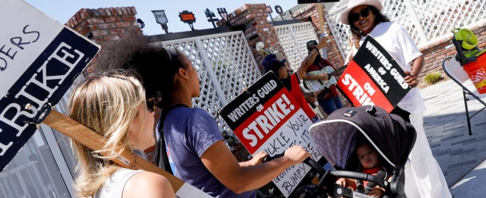 Members of SAG-AFTRA walk the picket line at the SAG-AFTRA and WGA strike at Amazon Studios on August 17, 2023 in Culver City, California. (Photo by River Callaway/Variety via Getty Images)