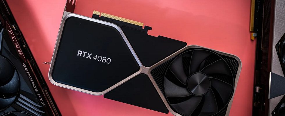 An Nvidia RTX 4080 graphics card on a salmon pink surface.