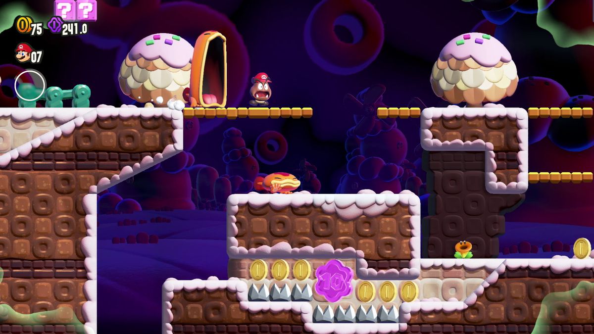 Mario, en tant que Goomba, s'enfuit d'un Maw-Maw dans une capture d'écran de Super Mario Bros. Wonder