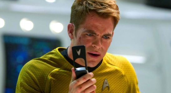 Chris Pine as Captain Kirk in Star Trek talking to a communicator