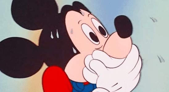 Surprised Mickey Mouse with hands over mouth