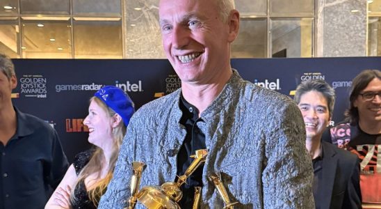 Swen Vincke with an armful of Golden Joystick Awards.