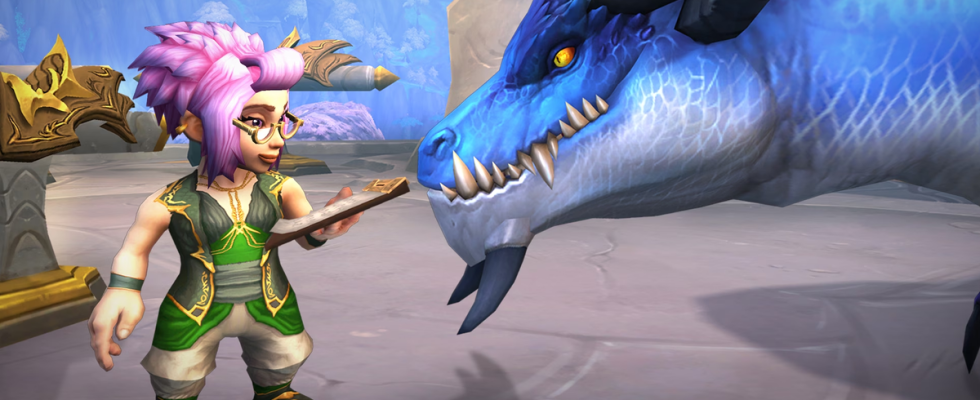 A gnome looks over a ledger with spectacles on, while her dragonriding companion leans in, in World of Warcraft: Dragonflight.