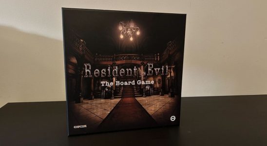Resident Evil: The Board Game box on a black table with a white background