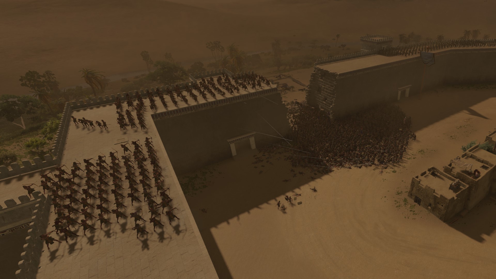 Revue de Total War Pharaoh : un siège lors d'une tempête de sable.