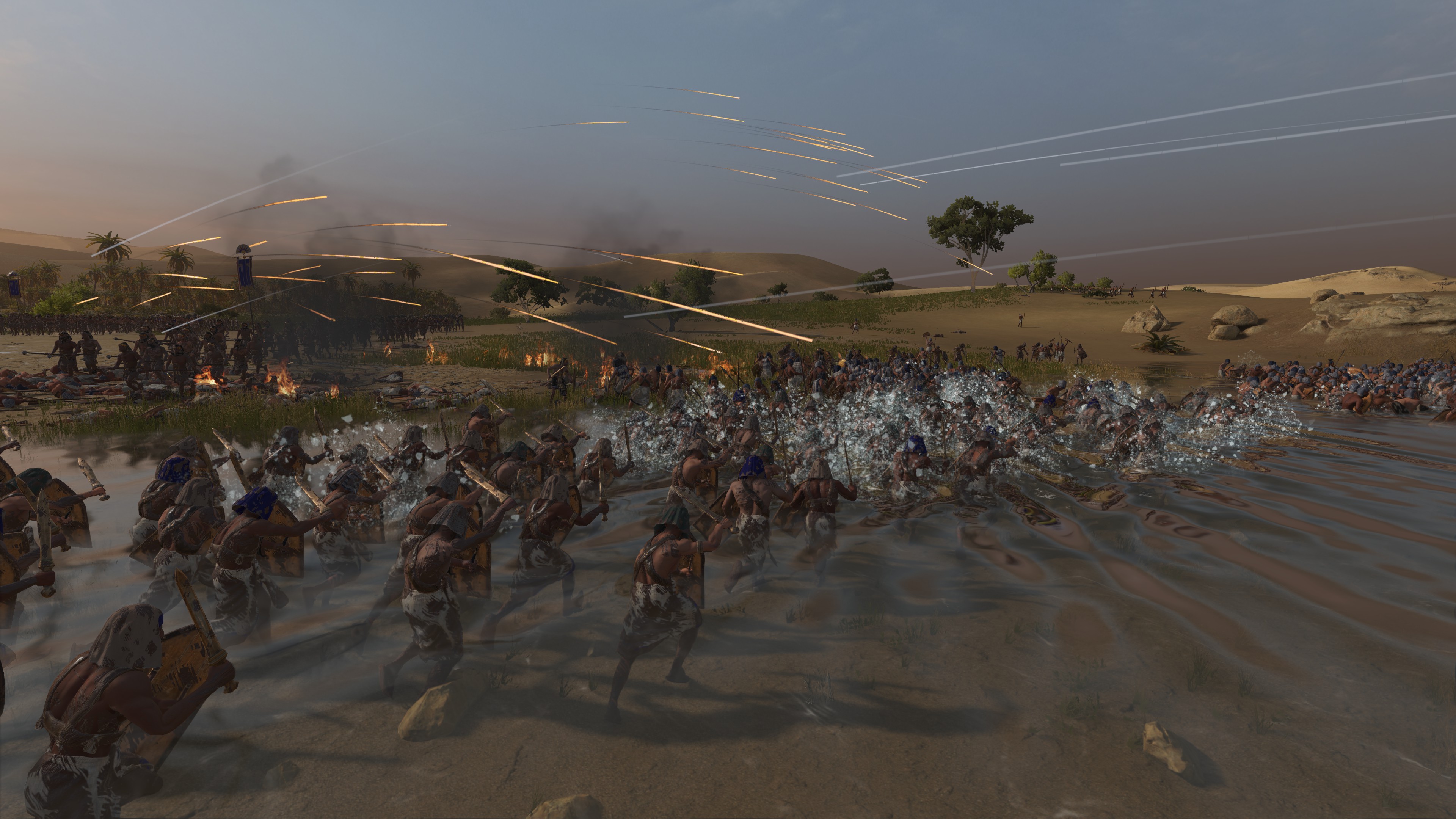 Une bataille au-dessus d'une rivière dans Total War : Pharaoh.