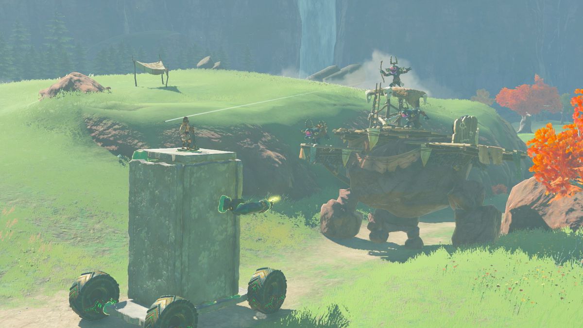 Une image de Link chevauchant un véhicule en pierre construit par un joueur dans The Legend of Zelda : Tears of the Kingdom. 