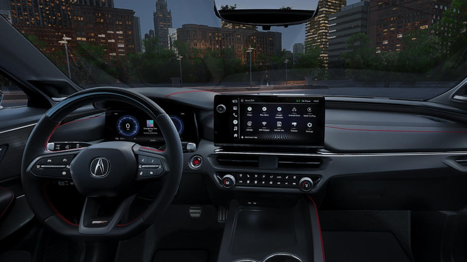 Photo de marketing interne du SUV Acura ZDX.  L'intérieur du véhicule électrique présente l'écran central, le volant et d'autres fonctionnalités du tableau de bord.