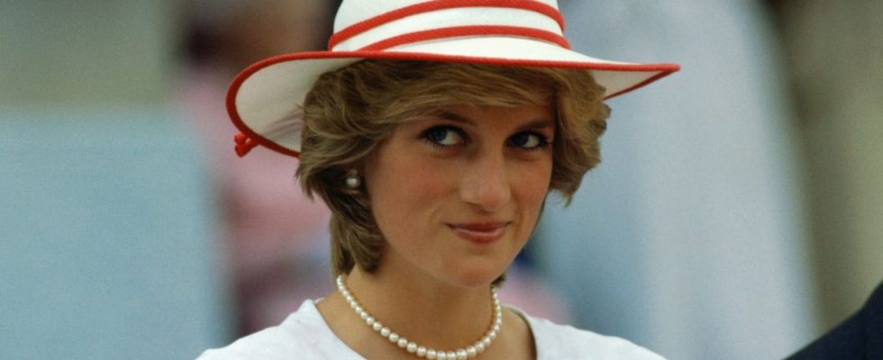 Diana, Princess of Wales, wears an outfit in the colors of Canada during a state visit to Edmonton, Alberta, with her husband