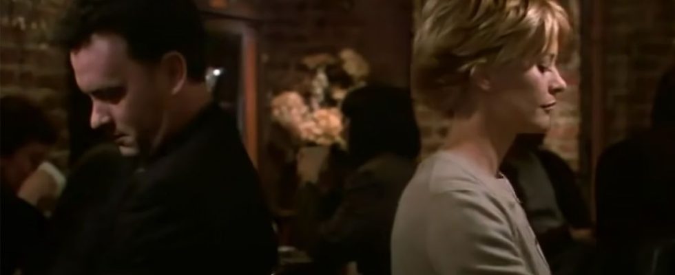 Tom Hanks and Meg Ryan ignore one another at dinner in You