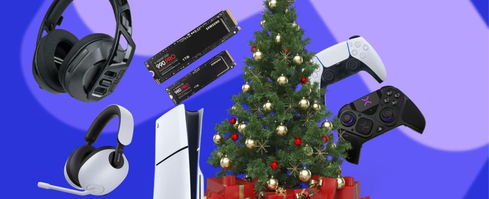 Various PS5 accessories scattered around a PS5 which is sat next to Christmas tree