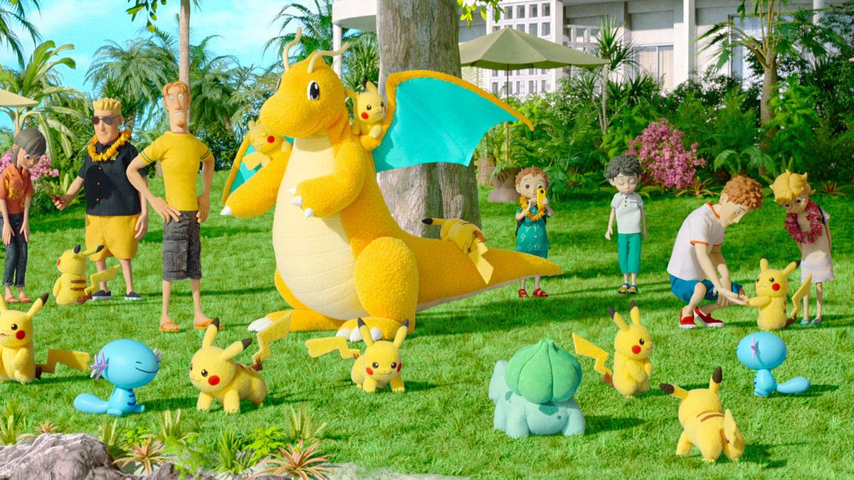 Un rassemblement en plein air mettant en vedette une douzaine de Pikachu et un Dragonite, ainsi qu'un assortiment d'autres Pokémon.
