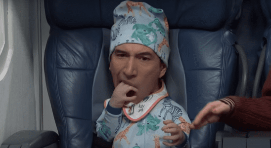 Adam Driver tries to eat his hand while dressed as a baby during an SNL sketch.