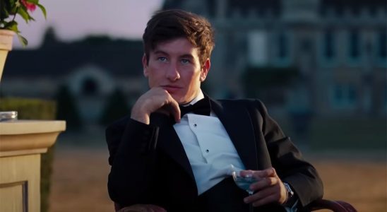 Barry Keoghan as Oliver Quick in a suit outside of Saltburn.