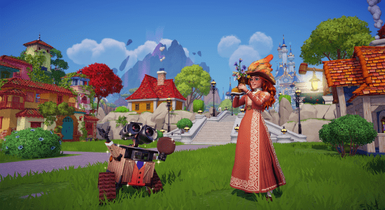 Image of WALL-E and female character with wizard clothing standing together in a village in Disney Dreamlight Valley.