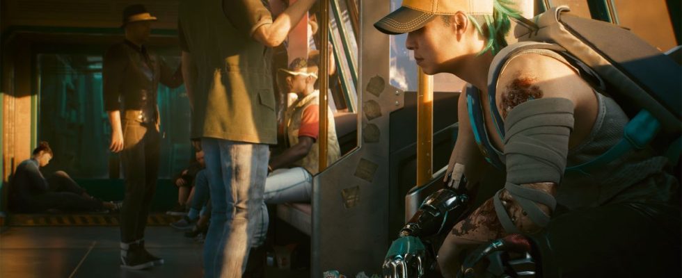 A woman sits on a Metro train in a still from Cyberpunk 2077.