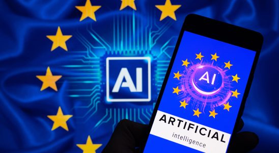 An icon representing Artificial Intelligence is being displayed on a smartphone, with AI and EU stars visible in the background, in this photo illustration. EU policymakers are reaching a political agreement that is poised to become the global benchmark for regulating Artificial Intelligence, in Brussels, Belgium, on December 12, 2023. (Photo by Jonathan Raa/NurPhoto via Getty Images)
