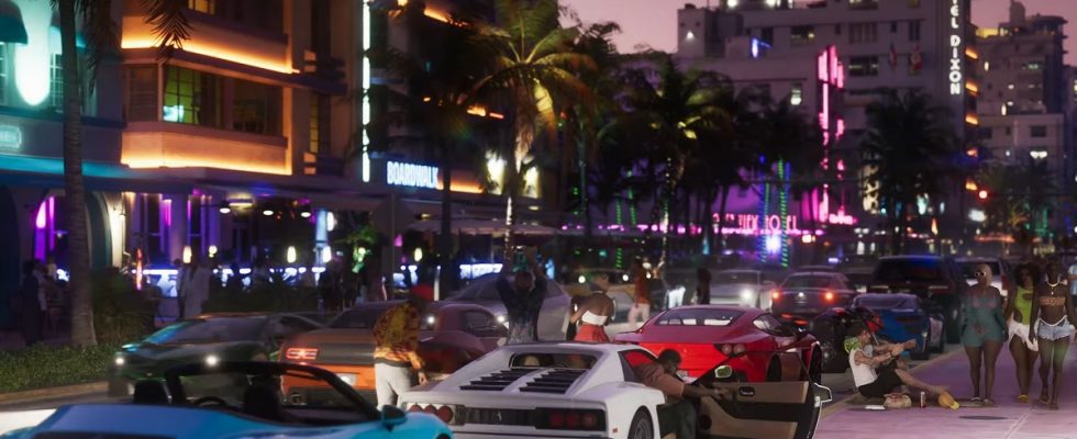 GTA 6: a row of sports cars parked along the side of a busy street at night.