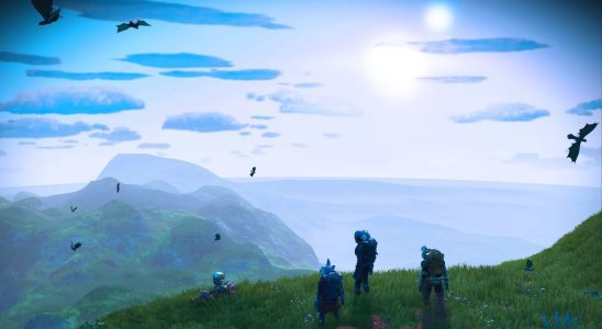 Space explorers looking out over a planet in No Man