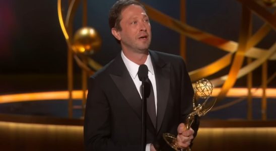 A screenshot of Ebon Moss-Bacrach holding his Emmy giving a speech at the 75th Emmy Awards.