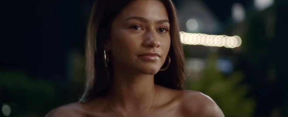 Zendaya looking forward while wearing a strapless blue dress in Challengers.