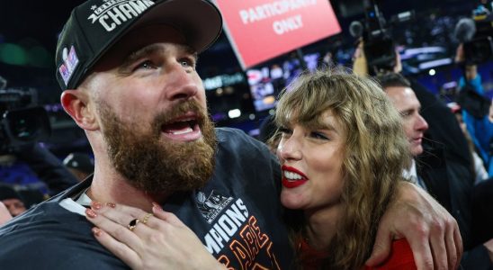 BALTIMORE, MARYLAND - JANUARY 28: Travis Kelce #87 of the Kansas City Chiefs (L) celebrates with Taylor Swift after defeating the Baltimore Ravens in the AFC Championship Game at M&T Bank Stadium on January 28, 2024 in Baltimore, Maryland.