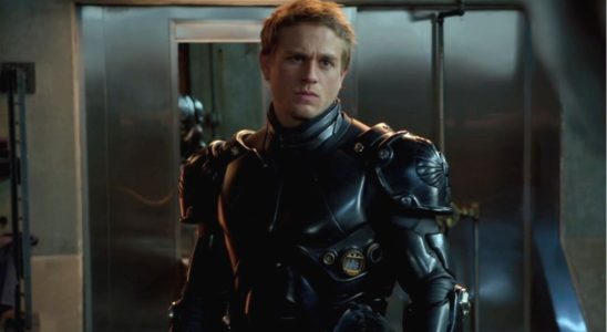 Charlie Hunnam stands dressed in his jaeger suit in Pacific Rim.