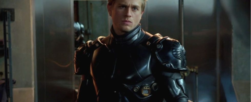 Charlie Hunnam stands dressed in his jaeger suit in Pacific Rim.