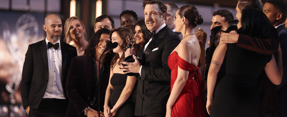 Jason Sudeikis and cast and crew accept the Outstanding Comedy Series award for