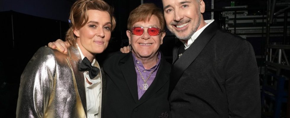 LOS ANGELES, CALIFORNIA - FEBRUARY 03: (L-R) Brandi Carlile, Elton John, and David Furnish attend MusiCares Persons of the Year Honoring Berry Gordy and Smokey Robinson at Los Angeles Convention Center on February 03, 2023 in Los Angeles, California. (Photo by Kevin Mazur/Getty Images for The Recording Academy)