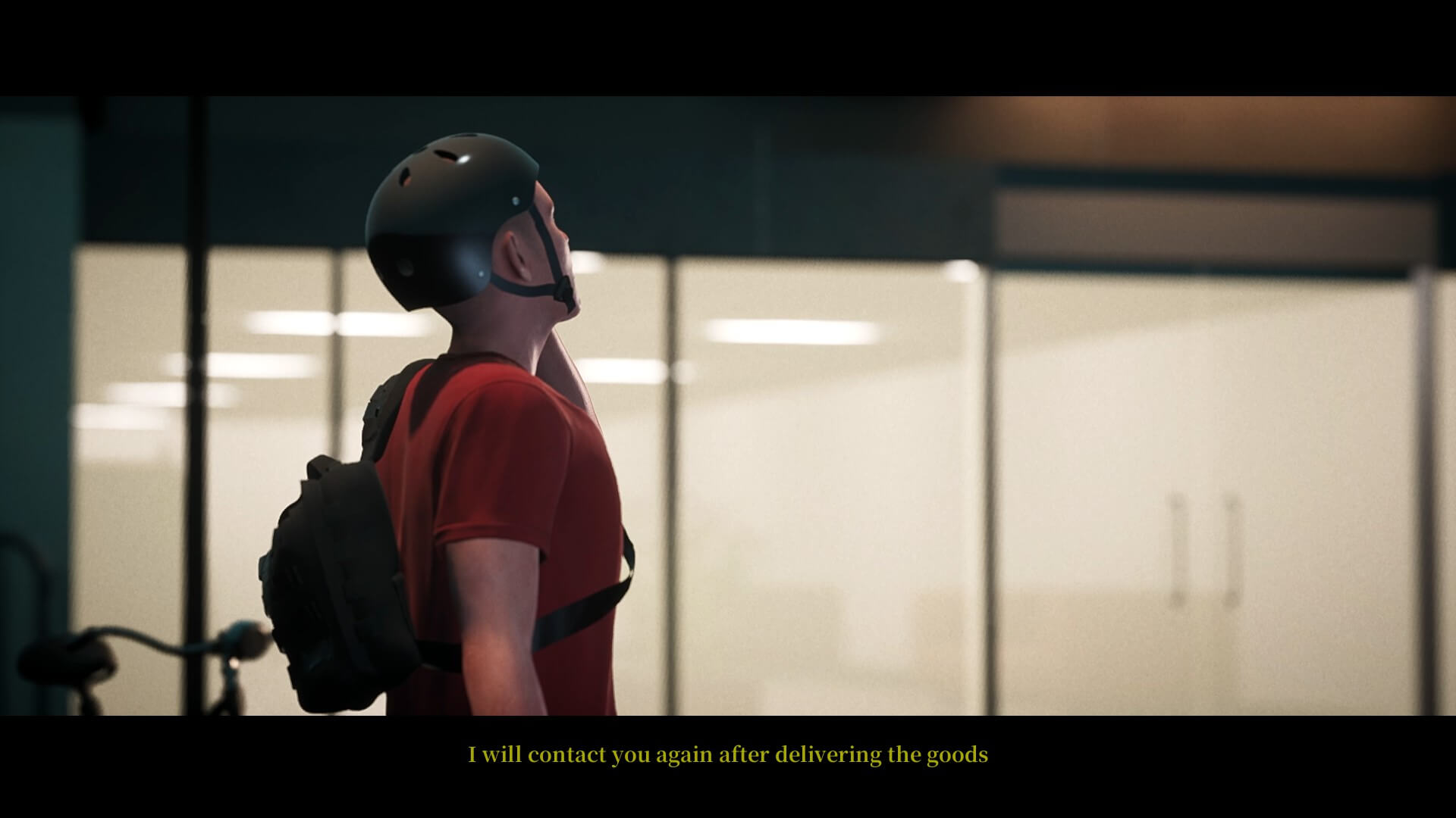 Notre protagoniste principal debout à l’extérieur d’un bâtiment.  Il porte un casque de vélo et un t-shirt rouge.  Le texte ci-dessous appartient au personnage principal et est de couleur jaune.