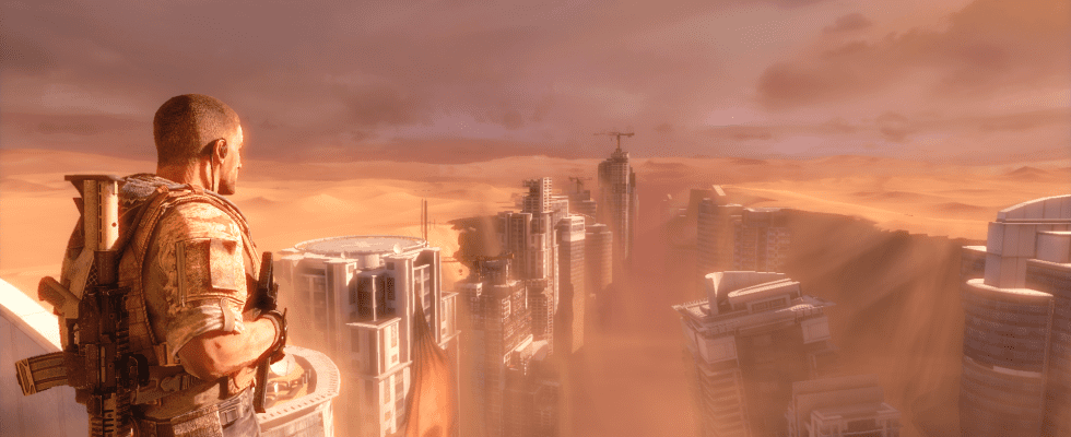 A soldier looks over a sand-blasted city in a screenshot from Spec Ops: The Line.