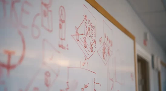 Indiana Jones and the Great Circle: a whiteboard showing the Quake logo and the letters "AKE."