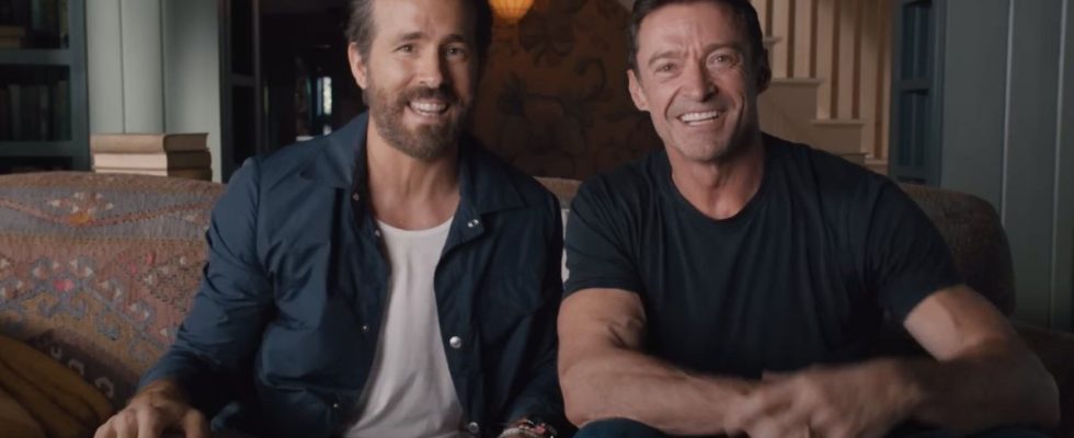 Hugh Jackman and Ryan Reynolds sitting side by side in the Deadpool 3 announcement video