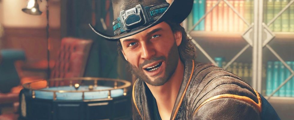 Close-up of man grinning with a cowboy hat