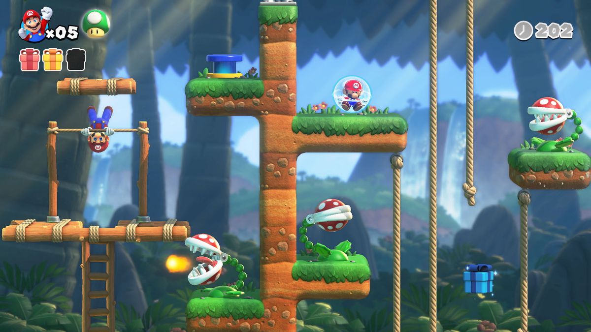 Mario tourne sur une barre fixe dans un niveau de jungle rempli de plantes Pirhana