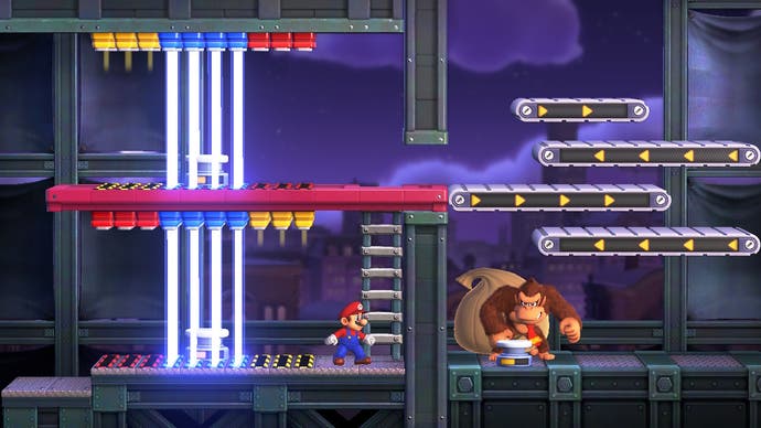 Mario affronte Donkey Kong dans un combat de boss avec des portes laser