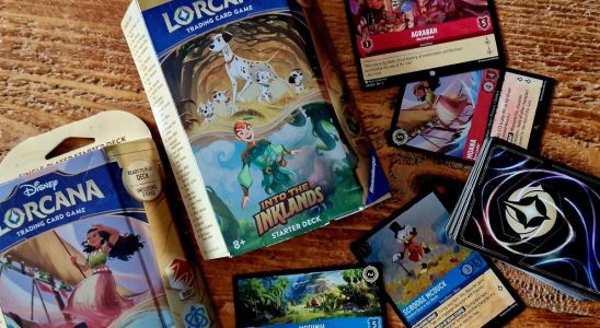 Disney Lorcana Into the Inklands boxes and cards on a wooden table