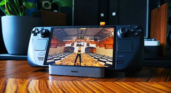 Tomb Raider 2 Remastered running on Steam Deck sitting on wood table