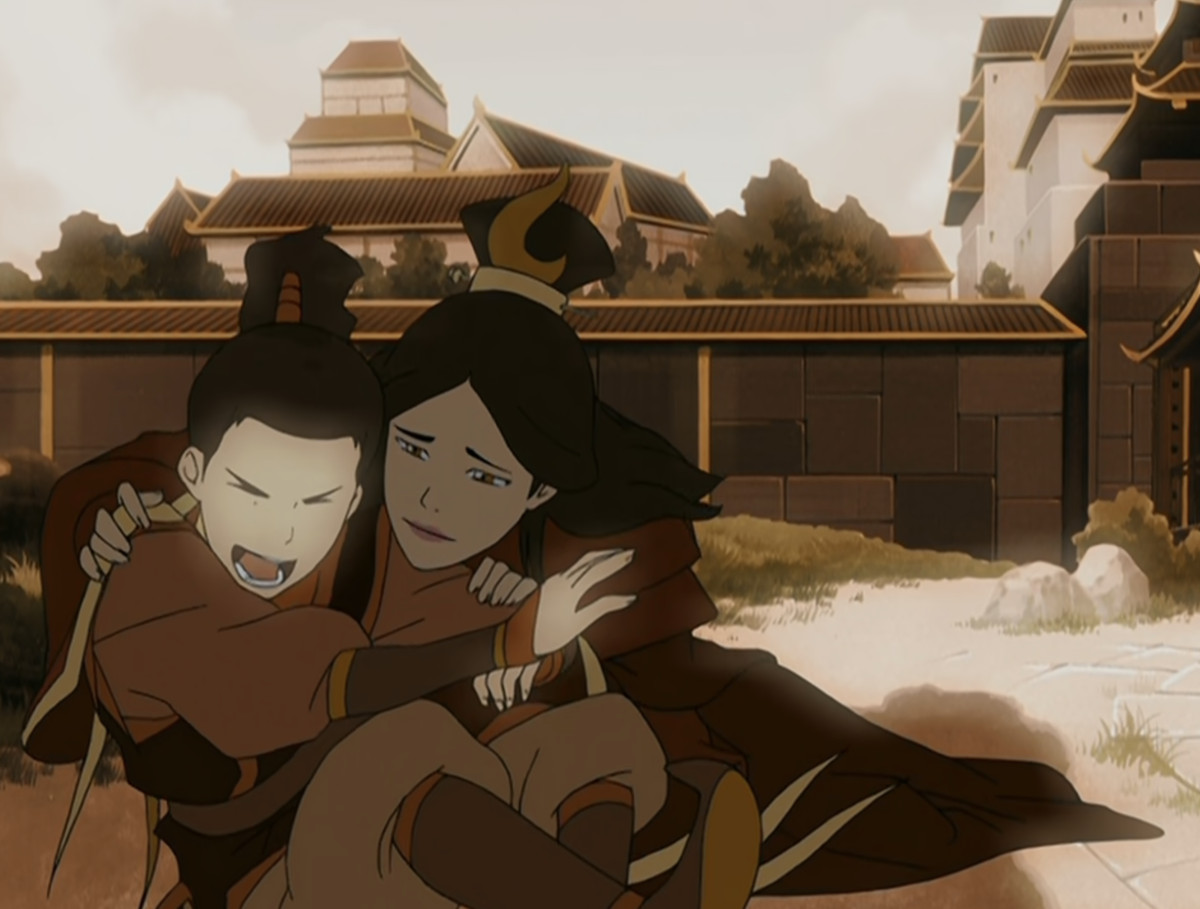 Une image de la série télévisée d'animation Avatar : Le dernier maître de l'air montrant un souvenir de Zuko lorsqu'il était enfant.  Il est assis au bord d'un étang avec sa mère et elle le tient dans ses bras pendant qu'il rit. 