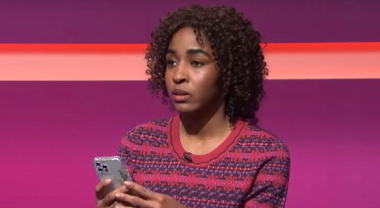 Ayo Edebiri texting during a fake game show on SNL.