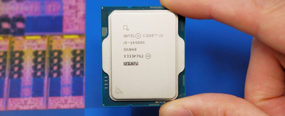 Intel Core i9 14900K CPU on a box and inside a motherboard socket.