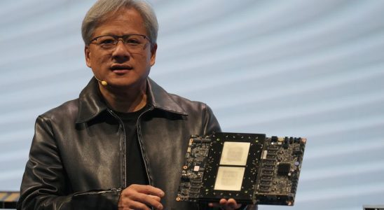 TAIPEI, TAIWAN - 2023/06/01: Jensen Huang, President of NVIDIA holding the Grace hopper superchip CPU used for generative AI at supermicro keynote presentation during the COMPUTEX 2023. The COMPUTEX 2023 runs from 30 May to 02 June 2023 and gathers over 1,000 exhibitors from 26 different countries with 3000 booths to display their latest products and to sign orders with foreign buyers.