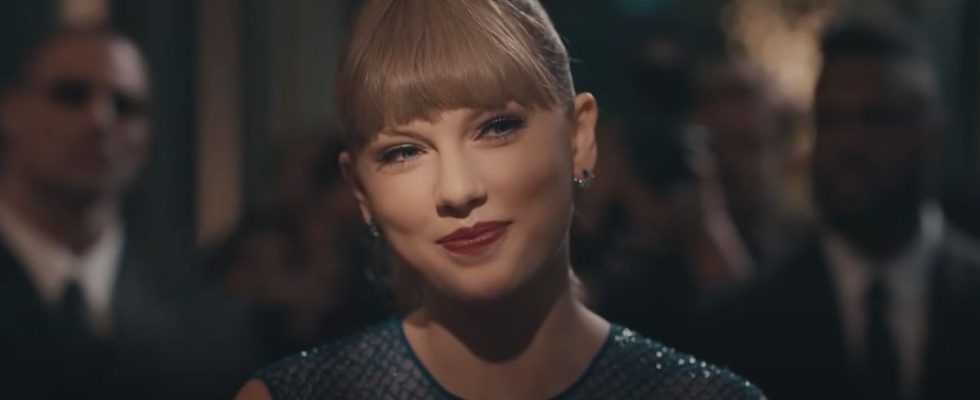 Taylor Swift smiling in the Delicate music video.
