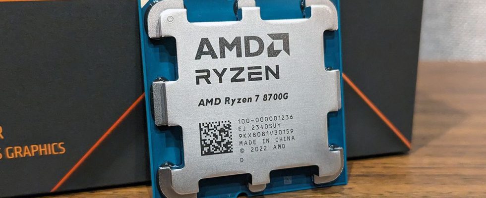 AMD Ryzen 7 8700G leaning against its box