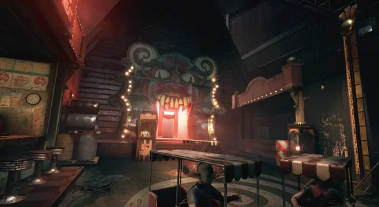 The Outlast Trials: a creepy, carnivalesque area with a door shaped like the devil's mouth.