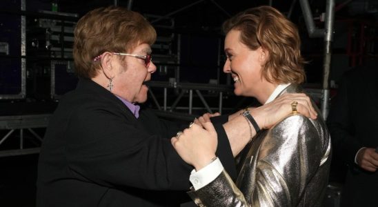 LOS ANGELES, CALIFORNIA - FEBRUARY 03: (L-R) Elton John and Brandi Carlile attend MusiCares Persons of the Year Honoring Berry Gordy and Smokey Robinson at Los Angeles Convention Center on February 03, 2023 in Los Angeles, California. (Photo by Kevin Mazur/Getty Images for The Recording Academy)