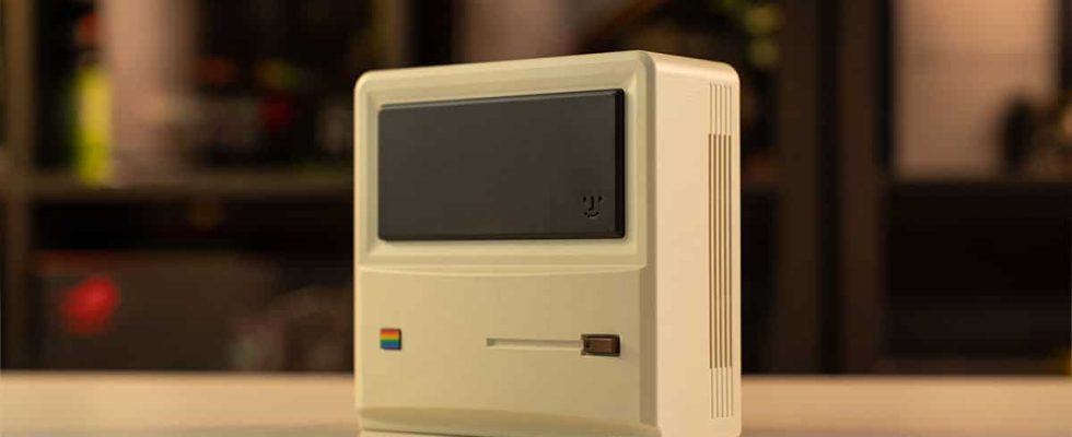 An apple computer sitting on a table.