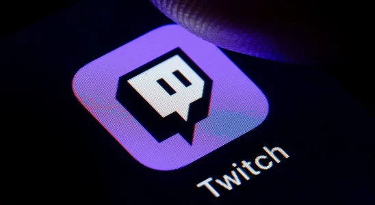 A finger about to press the Twitch button on a screen.